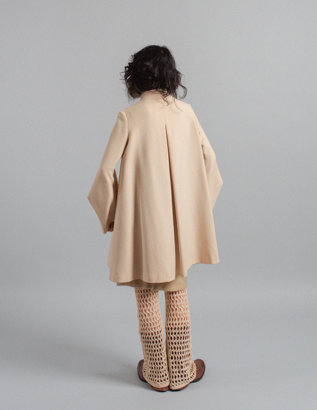 Sybilla vintage eggshell sculptural wool swing coat back view