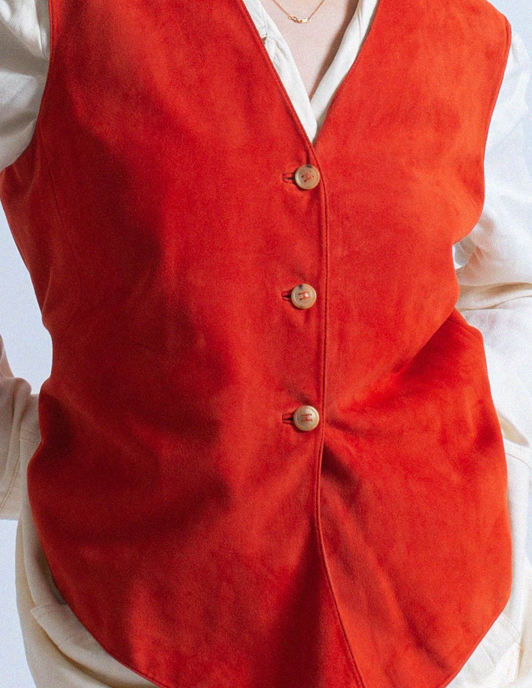 Hermès vintage orange goat suede and lambskin vest detail